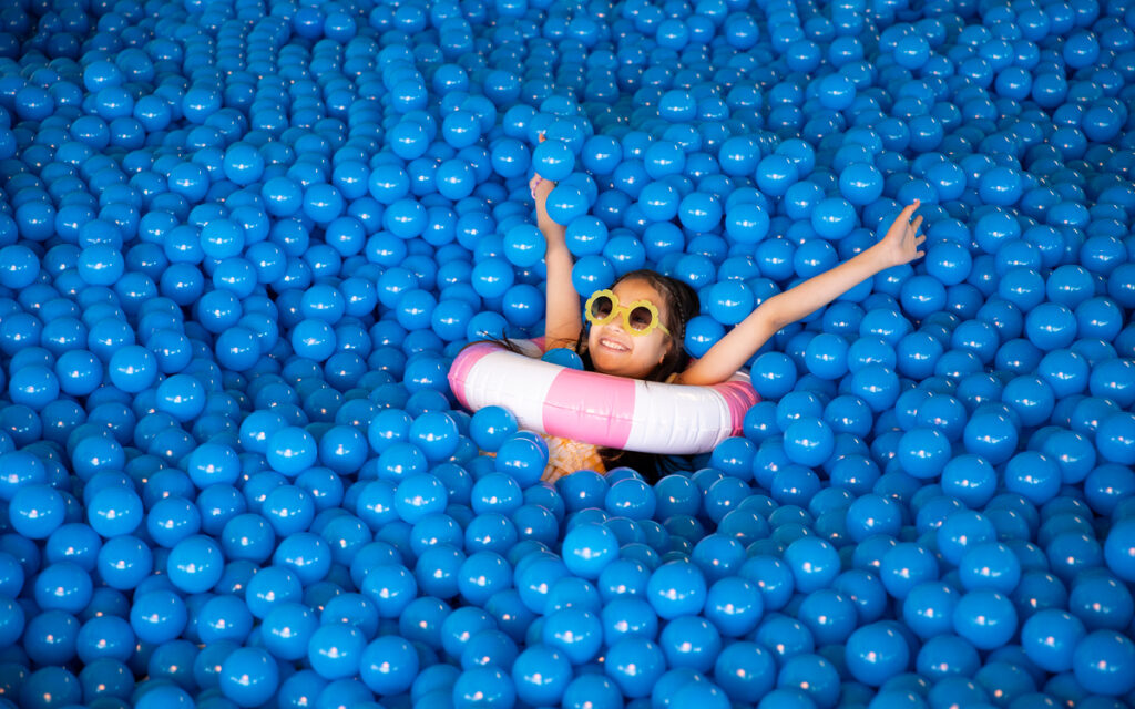 Child Playing in Ball Pit Deerfoot City The Pool Room